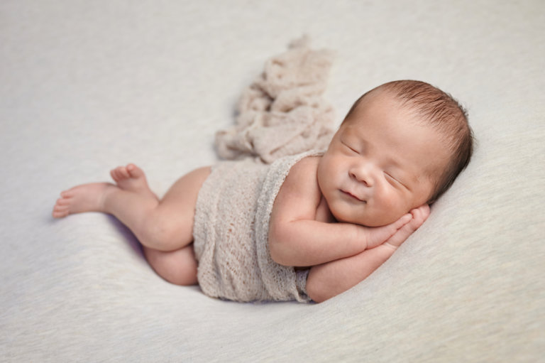Baby photographer with newborn examples for boy in Inland Empire, California