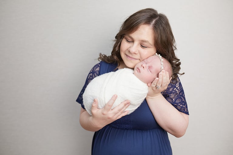 Mom in blue Dress and Baby in Pearls for girl in Des Plaines, IL